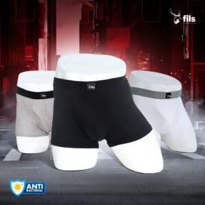 Three pairs of men's underwear in black, gray, and white on a dark background with 'fils' branding.