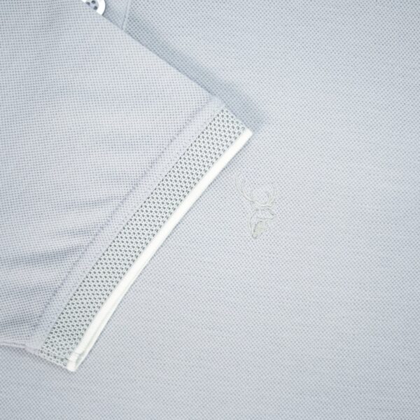 Close-up of a light gray shirt with a mesh panel on a light gray background