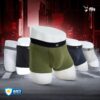 Set of men's underwear displayed on mannequin forms with a dark industrial background.