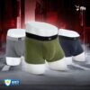 Three pairs of men's underwear in gray, green, and black on a dark background with 'fils' branding.