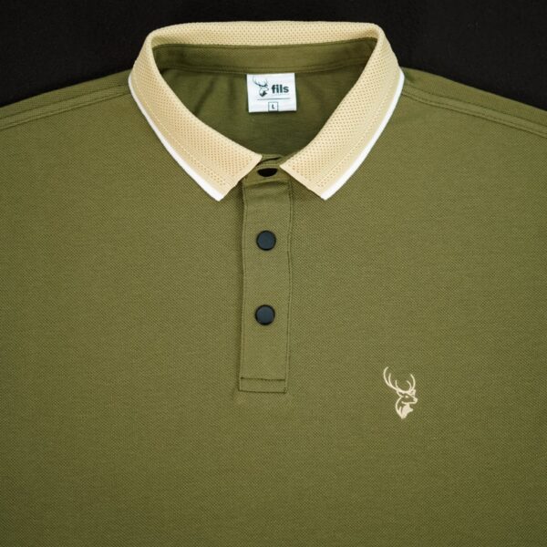 Green polo shirt with beige collar and fils logo on a black background