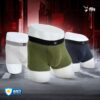 Three pairs of men's underwear in white, green, and black on a dark background with 'fils' branding.