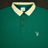Green polo shirt with a white collar and fil logo on a black background